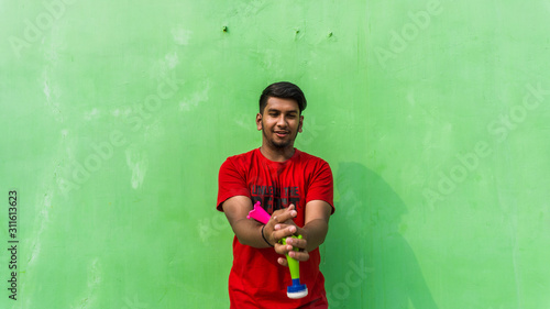 Young man with firki and pipuda for Makar Sankranti festival of India. Makar Sankranti is kite festival of India. It is also known as uttarayan photo