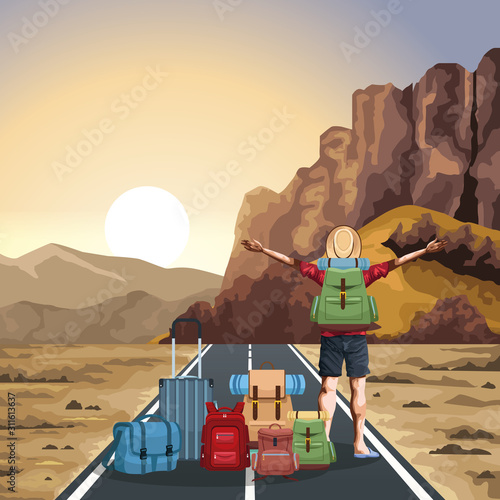 beautiful western landscape with travel bags and traveler man with his arms wide open