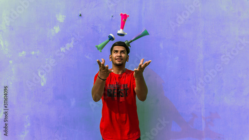 Young man with firki and pipuda for Makar Sankranti festival of India. Makar Sankranti is kite festival of India. It is also known as uttarayan photo