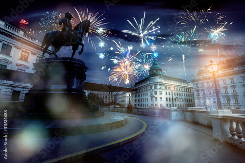 celebrate abstract holidays in vienna, austria, europe. christmas or new year fireworks at night. composite imagery