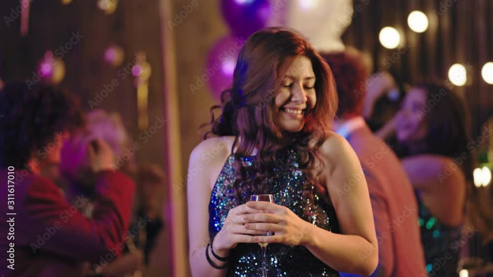 Portrait in front of the camera at big glamorous party beautiful lady playing lovely to the camera she smiling pretty and feeling happy Portrait in front of the camera at big glamorous party beautiful lady playing lovely to the camera she smiling pretty and feeling happy