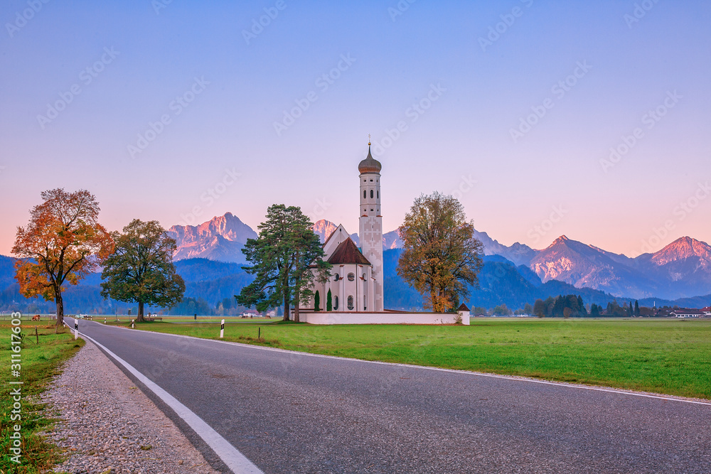 Beautiful St. Coloman church, popular tourist attraction in Bavaria, Germany at dawn