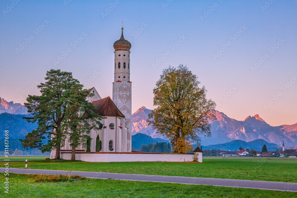 Beautiful St. Coloman church, popular tourist attraction in Bavaria, Germany at dawn