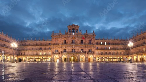 Salamanca, Spain. View of Plaza Mayor and City Hall building at dusk (static image with animated sky) photo