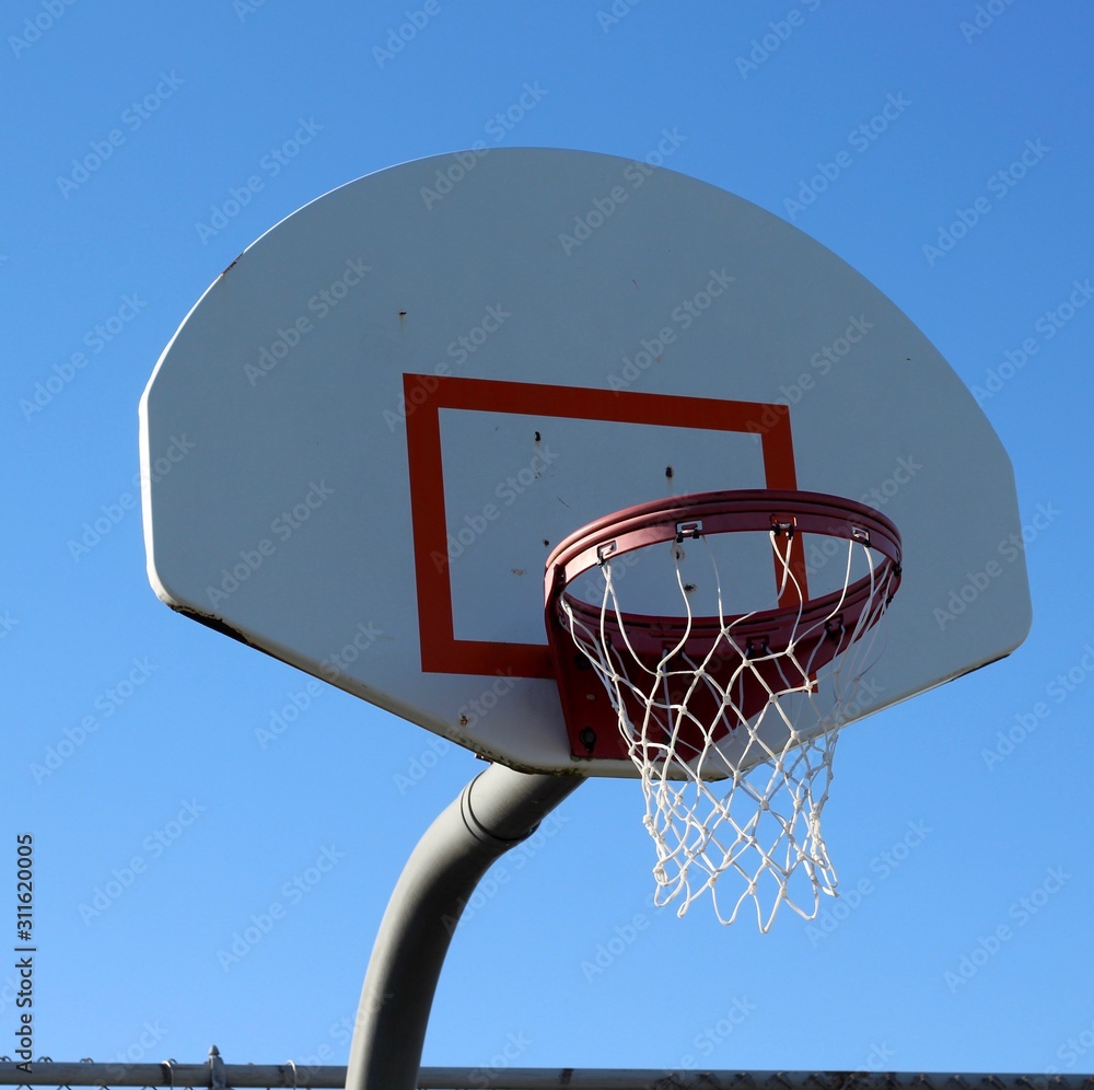 A close view of the basketball backboard hoop.