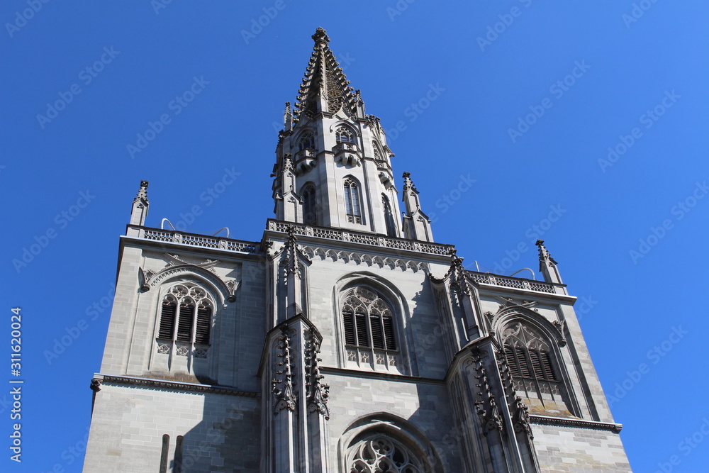 Fototapeta premium Historical Constance Cathedral (Konstanzer Muenster) isolated on blue sky in the city of Constance (Konstanz) in Baden-Wuerttemberg, Germany.