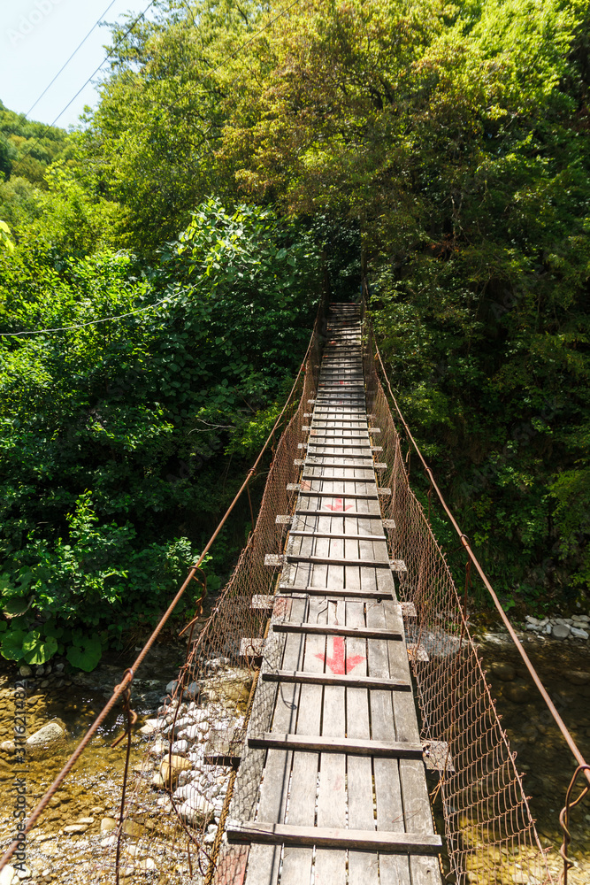 Look at the hanging bridge over the river Look at the hanging bridge over the river