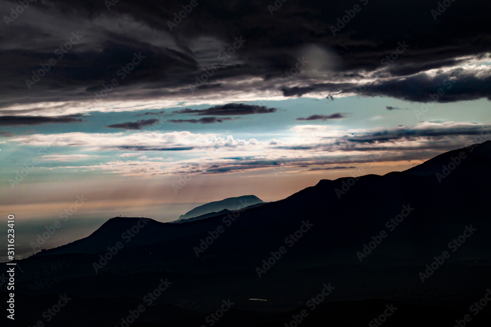 Top of a mountain above the clouds. Freedom before gravity