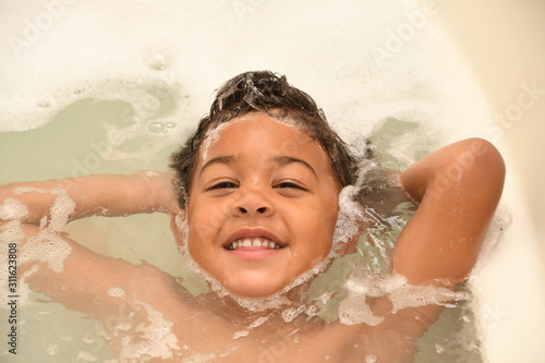 Toddler having fun at bathtime