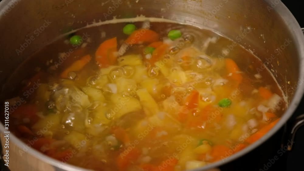 Vegetable soup. Vegetables in boiling water. Potatoes, carrots, onions, peas. Cooking vegetable soup. Vegetable soup. Vegetables in boiling water. Potatoes, carrots, onions, peas. Cooking vegetable soup.