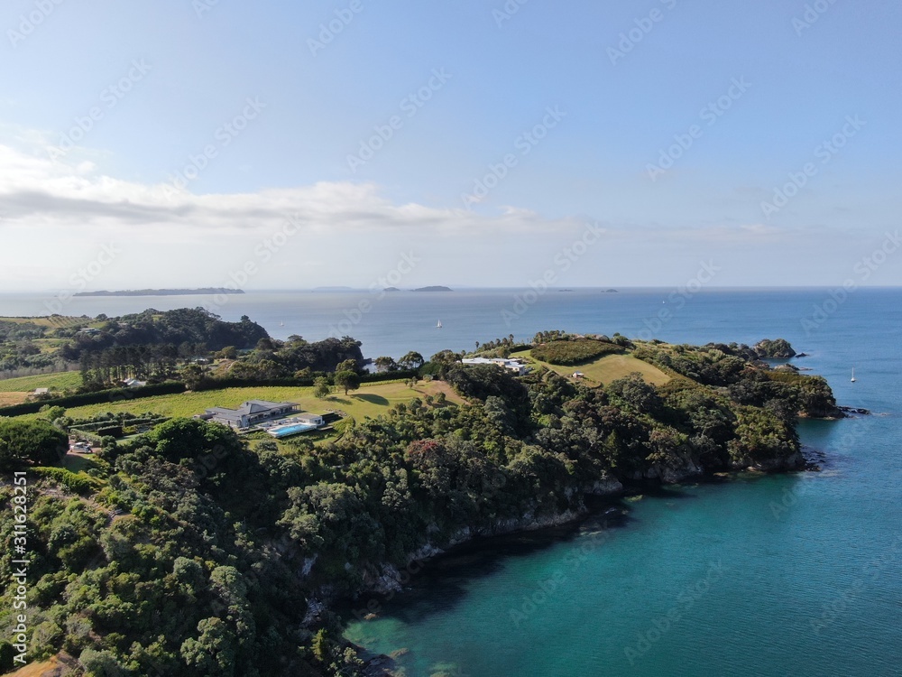 Waiheke Island, Auckland / New Zealand - December 24, 2019: The paradise island Waiheke with its stunning beaches, coastlines, hill terrains and vineyards