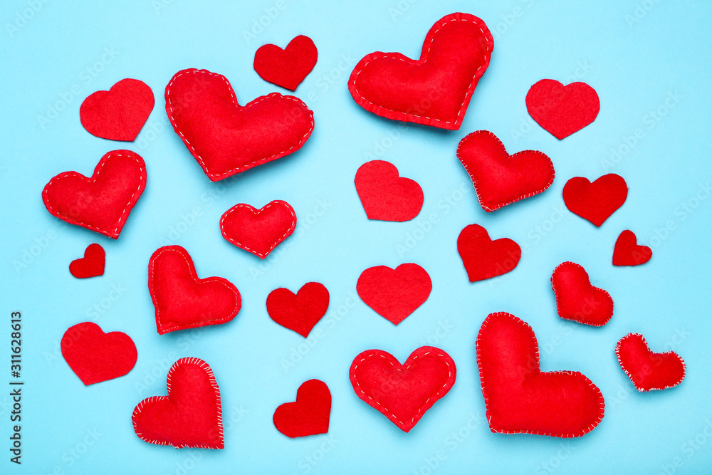 Fabric hearts on blue background Fabric hearts on blue background