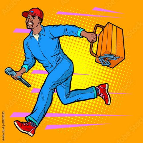 Male African master repairman runs