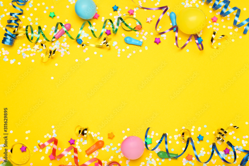Colorful ribbons with rubber balloons, paper stars and confetti on yellow background - obrazy, fototapety, plakaty 