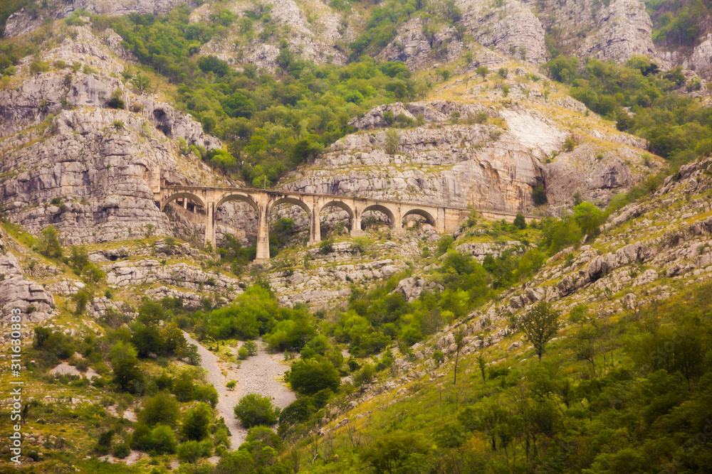 The view of old high mountain breathtaking railway viaduct or mountain bridge of old railway in MONTENEGRO, Europe