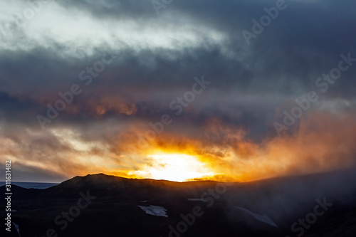 Sunset in mountain and misty terrain of Iceland. Nature and places for wonderful travels