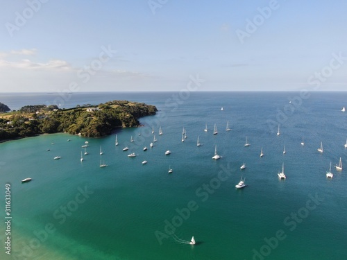 Waiheke Island, Auckland / New Zealand - December 24, 2019: The paradise island Waiheke with its stunning beaches, coastlines, hill terrains and vineyards photo