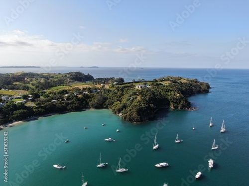 Waiheke Island, Auckland / New Zealand - December 24, 2019: The paradise island Waiheke with its stunning beaches, coastlines, hill terrains and vineyards photo