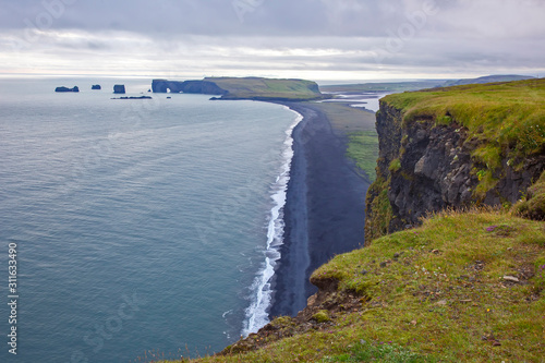 View of the cliffs of Dyrholaey in Iceland. Nature and places for wonderful travels photo