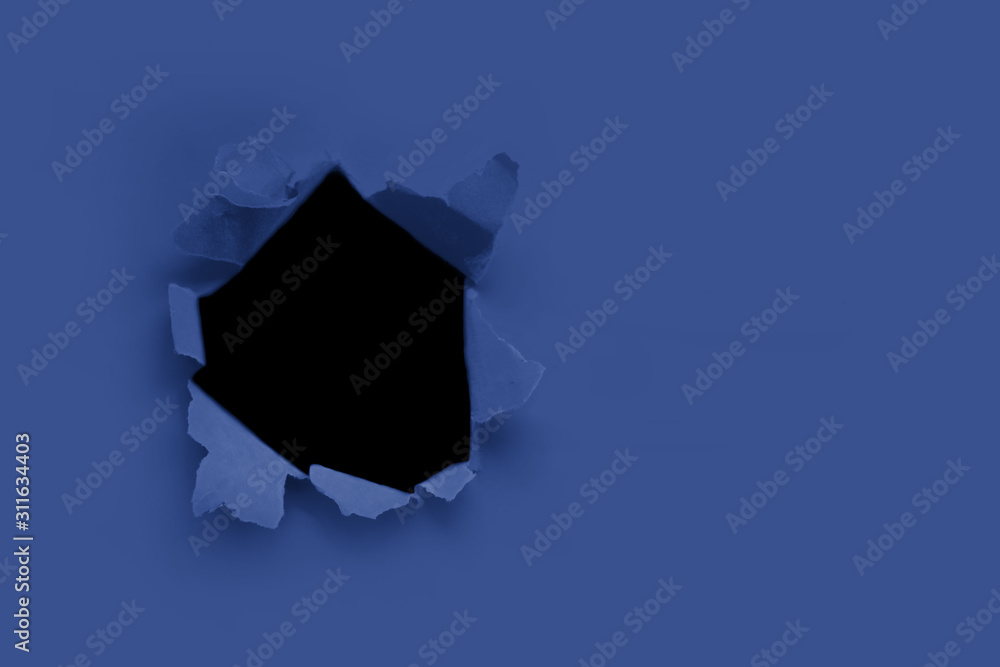 Breakthrough paper hole with black background toned with main trendy ...
