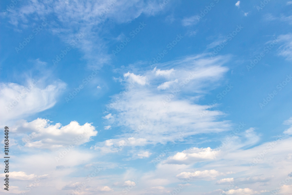Obraz premium White clouds in the blue sky. Background. Texture