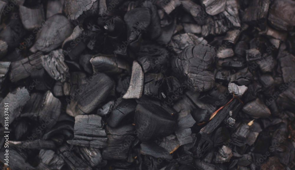 Barbecue grill coal close up. Black charcoal texture background Barbecue grill coal close up. Black charcoal texture background