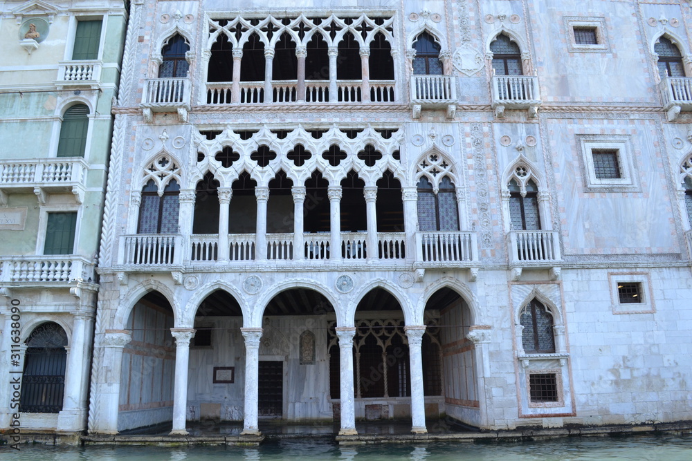 View of the magnificent facade of an old building in Venice.