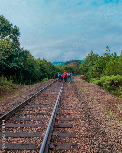 Students walking in train tracks