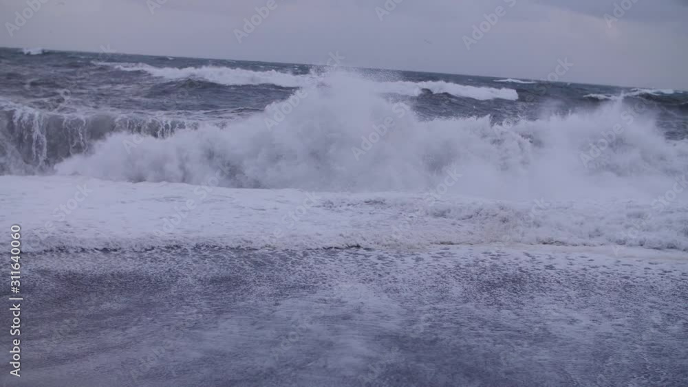 White waves breaking on the shore. Wave. Big waves. Storm. White waves breaking on the shore. Wave. Big waves. Storm.