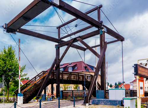 A bascule bridge with pedestrian bridge in Storkow over a canal in Brandenburg near Berlin. photo