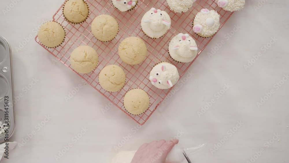 Flat lay. Step by step. Decorating vanilla cupcakes with white buttercream frosting for Easter. Flat lay. Step by step. Decorating vanilla cupcakes with white buttercream frosting for Easter.