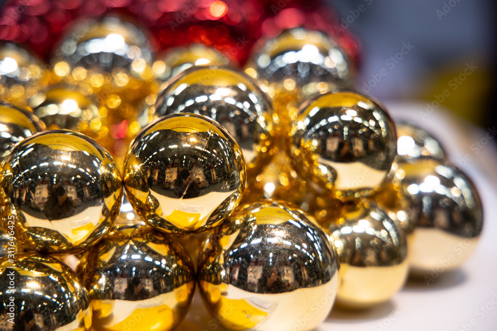 Golden Christmas balls in box. New Year decor. Golden Christmas balls in box. New Year decor.