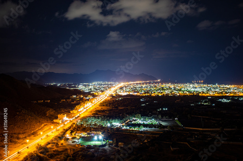 view from the mountain to the night city on the ocean