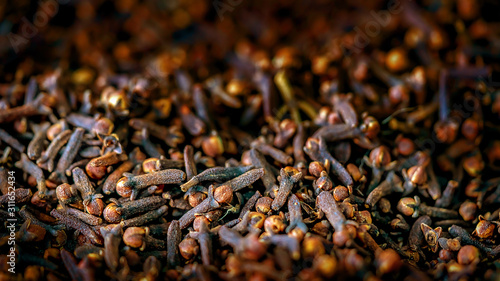 close up clove dried spicy herb for cooking and natural medicine. macro photography texture background