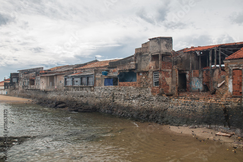 Old destroyed buildings at the shore, Salvador, Bahia, Brazil, South America