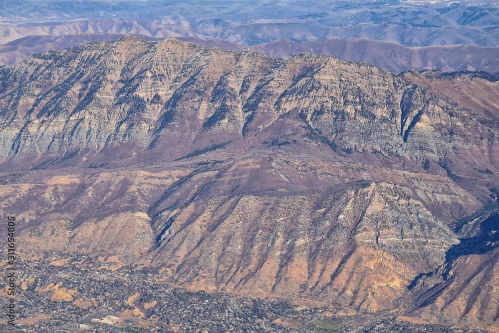 Wasatch Front Rocky Mountain Range Aerial view from airplane in fall including urban cities and the Great Salt Lake around Salt Lake City, Utah, United States of America. USA. Wasatch Front Rocky Mountain Range Aerial view from airplane in fall including urban cities and the Great Salt Lake around Salt Lake City, Utah, United States of America. USA.
