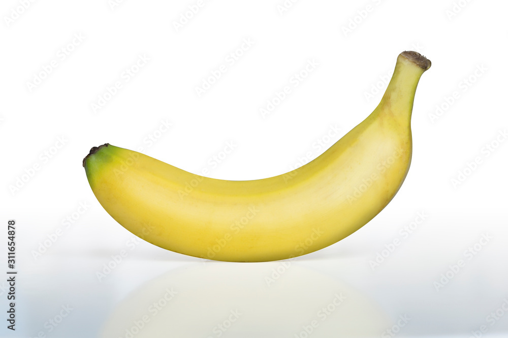 A banana stands alone on a white background A banana stands alone on a white background