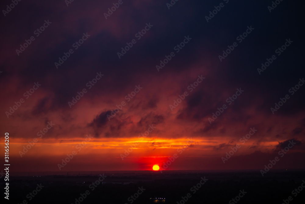 Epic Sunset. Sky. Foggy Clouds. Apocalypse. The sky before a thunderstorm. horizon. Gloomy clouds. End of the world. threat. Epic dramatic sunset Epic Sunset. Sky. Foggy Clouds. Apocalypse. The sky before a thunderstorm. horizon. Gloomy clouds. End of the world. threat. Epic dramatic sunset