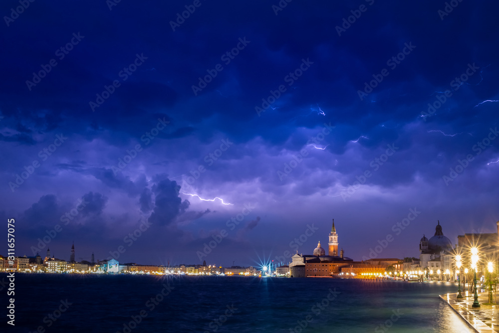 Venice - view from Giudecca to San Giorgio Maggiore at night during thunderstorm.