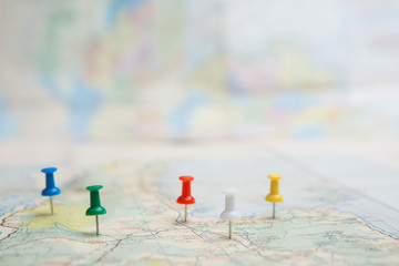 Selective focus of Colorful Many pins  on map background