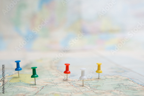 Selective focus of Colorful Many pins  on map background