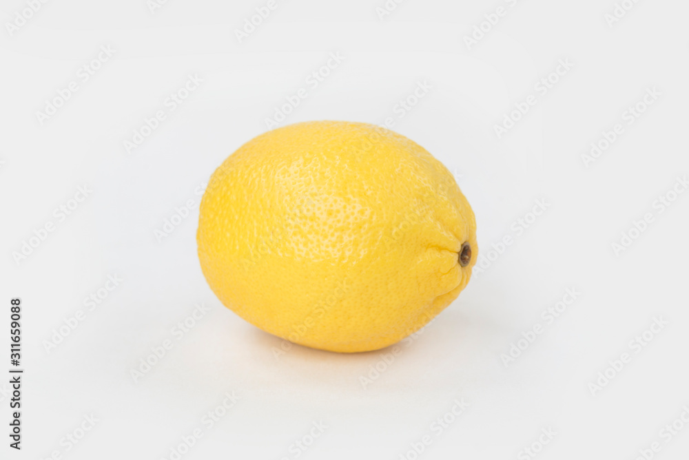 A golden lemon Isolated on solid background. A golden lemon Isolated on solid background.