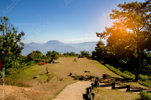 Point view with mountain range and thin layer of bluie sky  on the valleys, ChiangMai, Thailand photo