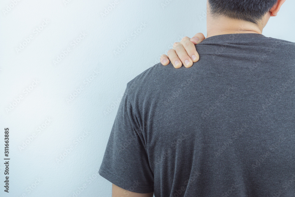 Closeup man suffering from neck and shoulder pain. Health care and medical concept. Closeup man suffering from neck and shoulder pain. Health care and medical concept.