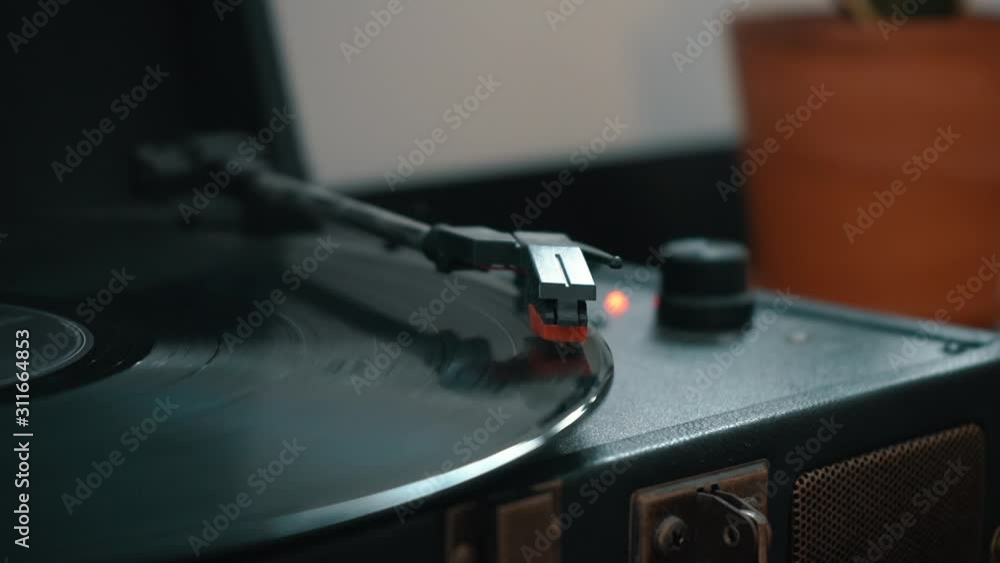 A close-up shot of a record spinning on a turntable. A close-up shot of a record spinning on a turntable.