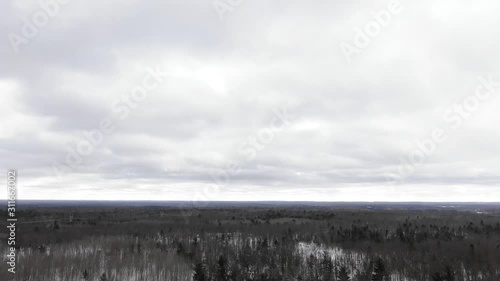 Winter party in the woods in Traverse City Michigan 4K drone shots over forest and open woods in winter snow covered scene logo goes here photo