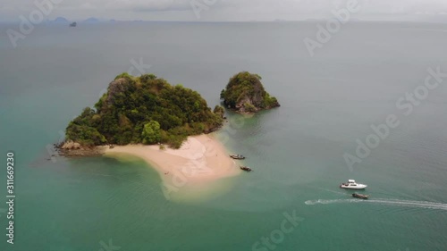 4k high angle aerial drone shot above tropical paradise island with white sand and turquoise crystal clear water, summer holiday destination, south east Asia , Andaman sea, travel Phuket Thailand photo