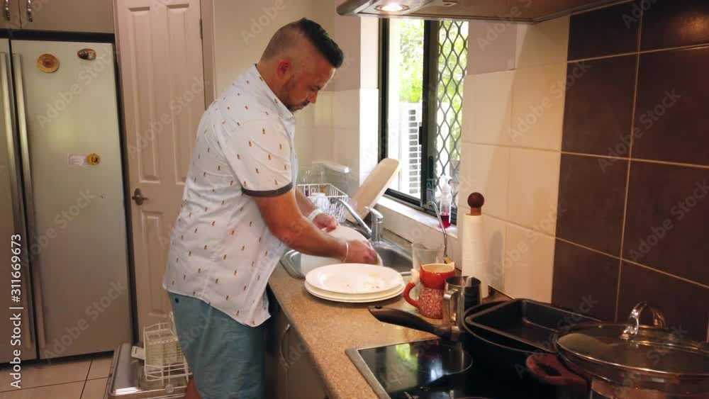 man washing the dishes in the sink, washing plates, rinsing plates and drying plates, man washing the dishes in the sink, washing plates, rinsing plates and drying plates,