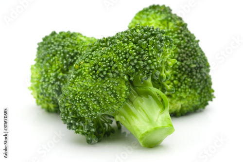 Fresh green broccoli on a white background.