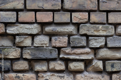 Old weathered brick wall fragment